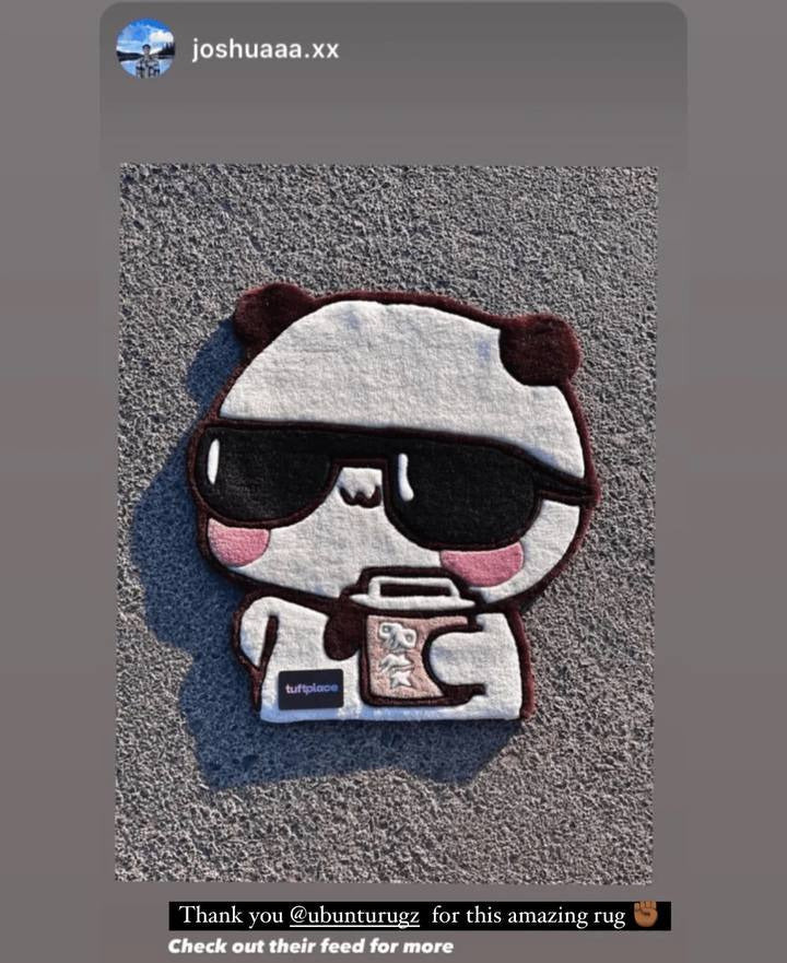 Panda-shaped rug with sunglasses and a coffee cup on a textured surface